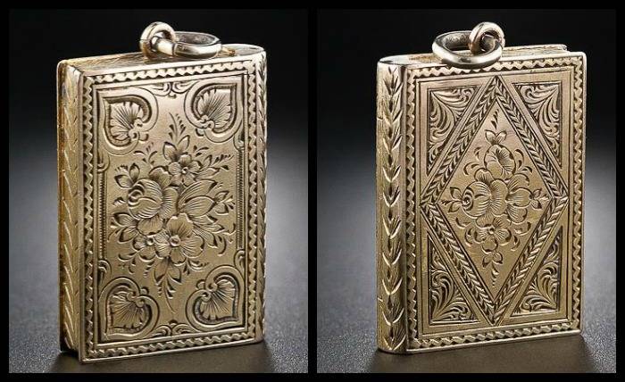 Antique Victorian book locket in engraved gold. 
